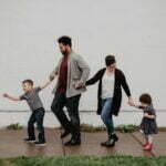 family of four walking at the street